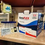 Effect of Semen Extenders on Pre-Freeze Shipped Semen - BotuPharma Flex Shipper and semen extenders on a lab counter