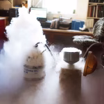 Storage Effects on Frozen Stallion Semen - nitrogen tank and shipper being filled showing vapor in the air in a lab